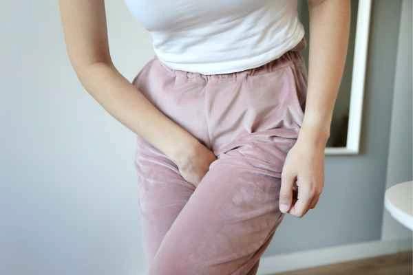 woman running for the toilet because of urinary incontinence Taunton
